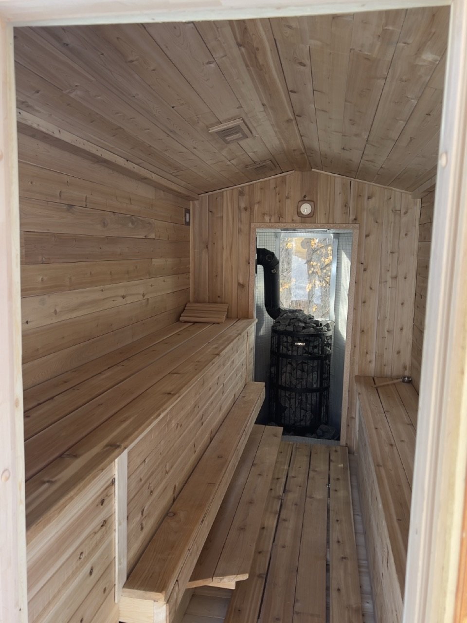 The mobile sauna's interior mid-build, framed and partly clad.