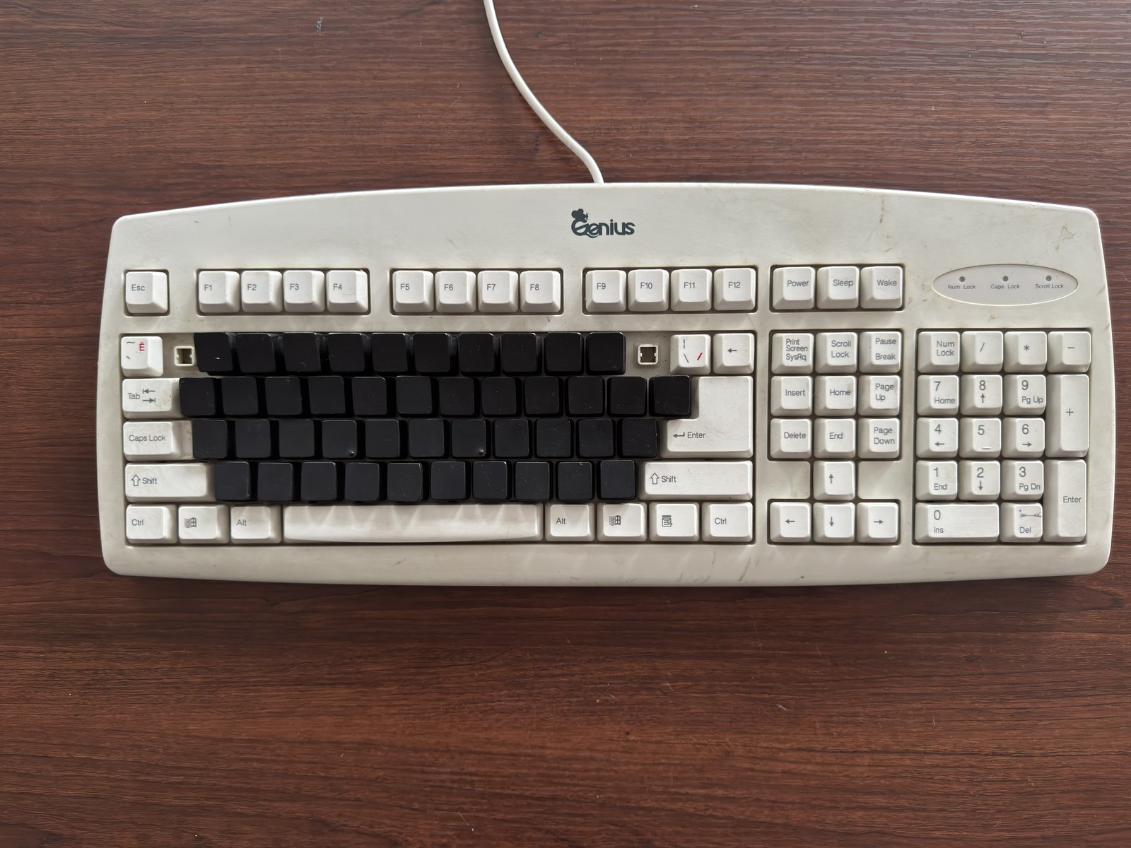 A keyboard mockup with the finger-rest zone keys marked out in black, demonstrating the RU19187U1 concept.